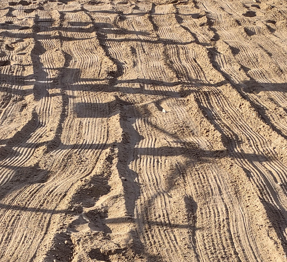 Raked beach sand